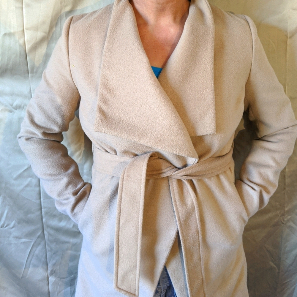 Beautiful wrap coat with pockets and belt.